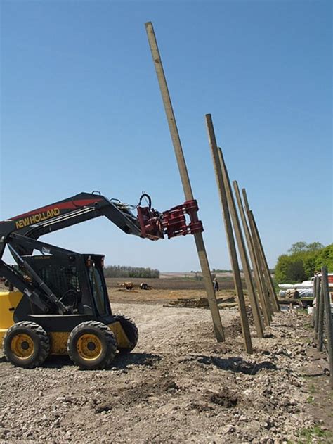 setting utility pole with skid steer|pole setter for digging.